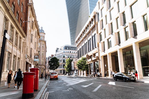 A London side street with black cab and red post box